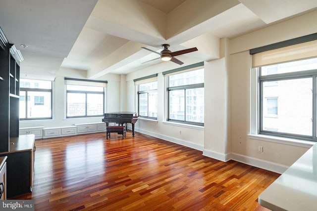 interior space featuring wood-type flooring and ceiling fan