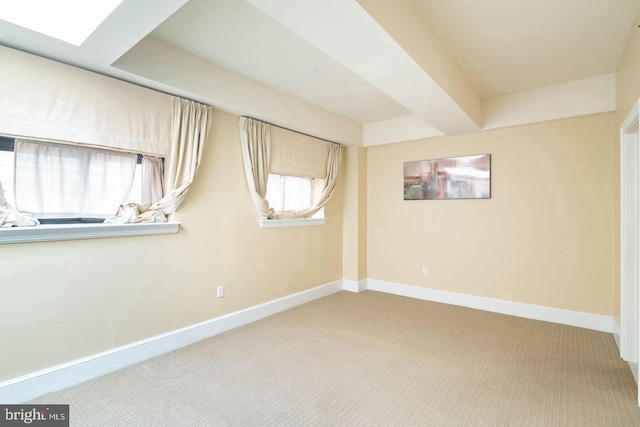 basement featuring light carpet