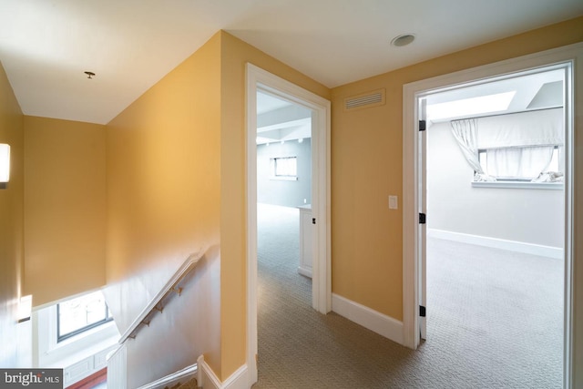 corridor with carpet flooring