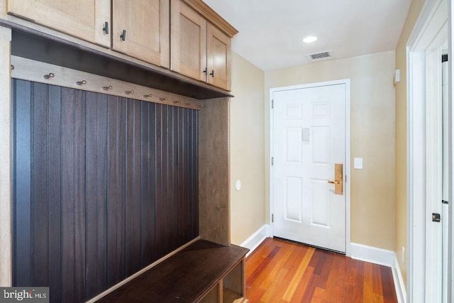 mudroom with dark hardwood / wood-style flooring