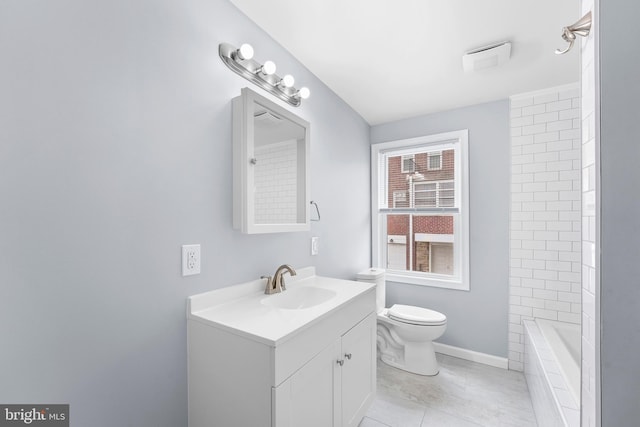 full bathroom with tiled shower / bath combo, vanity, toilet, and tile patterned floors