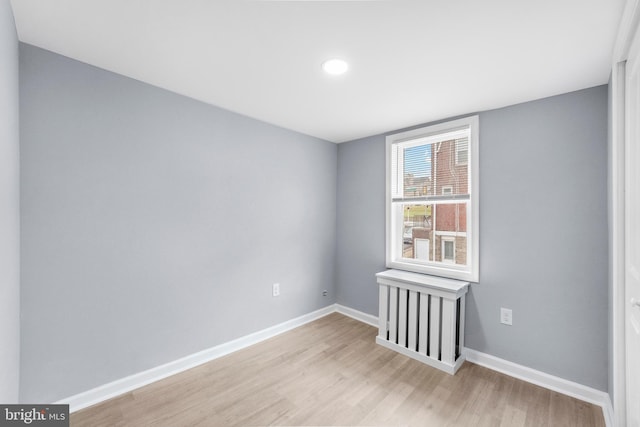 unfurnished room featuring light hardwood / wood-style floors