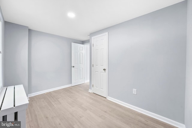 empty room with light wood-type flooring