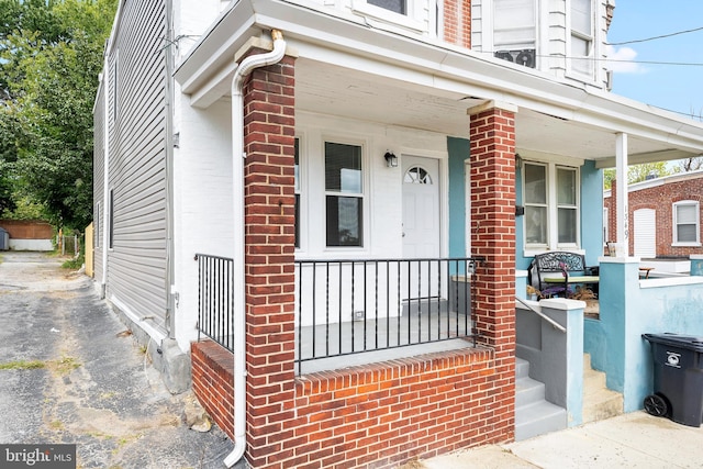 doorway to property with a porch