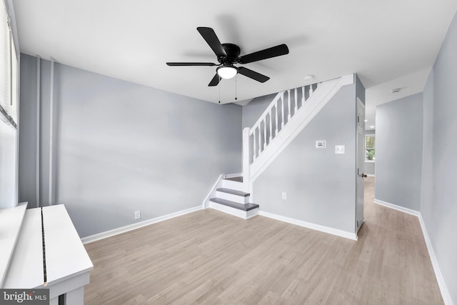 spare room featuring ceiling fan and light wood-type flooring