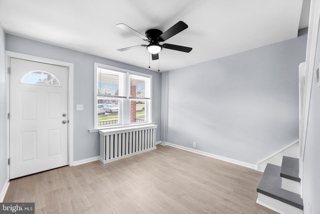 entryway with light hardwood / wood-style flooring and ceiling fan