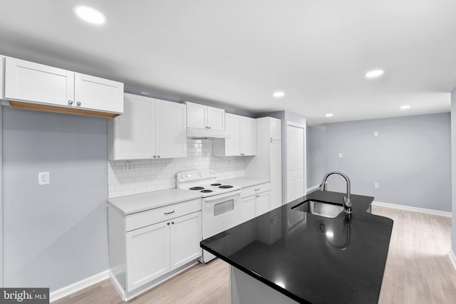 kitchen with white range with electric stovetop, sink, decorative backsplash, white cabinets, and light hardwood / wood-style floors