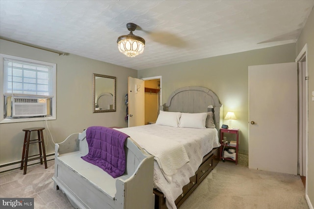 bedroom featuring cooling unit, a baseboard radiator, and light carpet