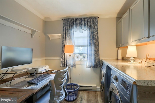 interior space with washer and dryer, crown molding, baseboard heating, and hardwood / wood-style flooring