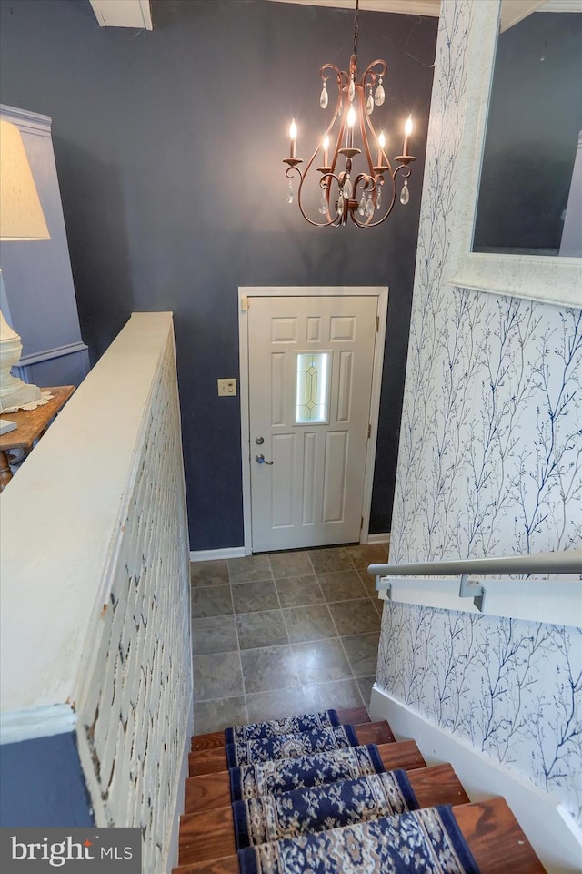 foyer entrance featuring tile patterned flooring and a chandelier