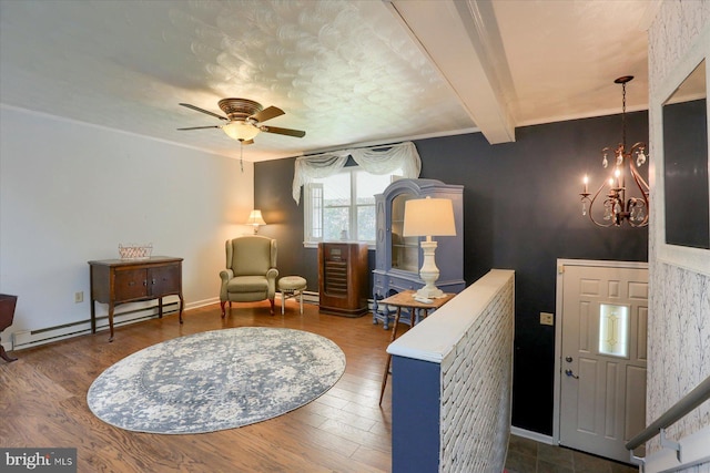 sitting room featuring ceiling fan with notable chandelier, a baseboard radiator, dark hardwood / wood-style floors, and beamed ceiling