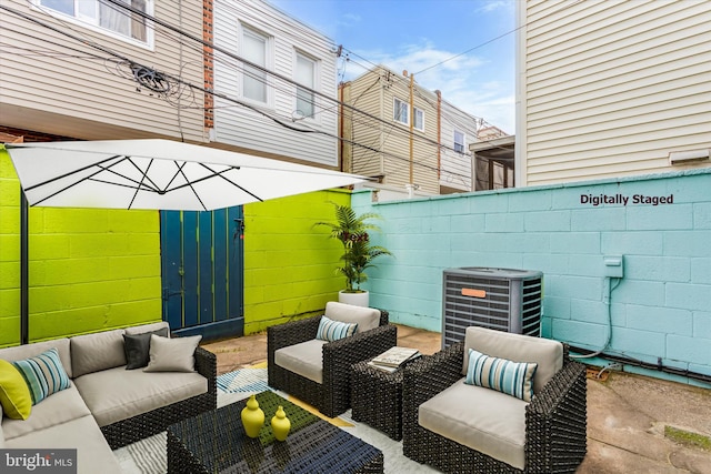 view of patio with central AC and an outdoor living space