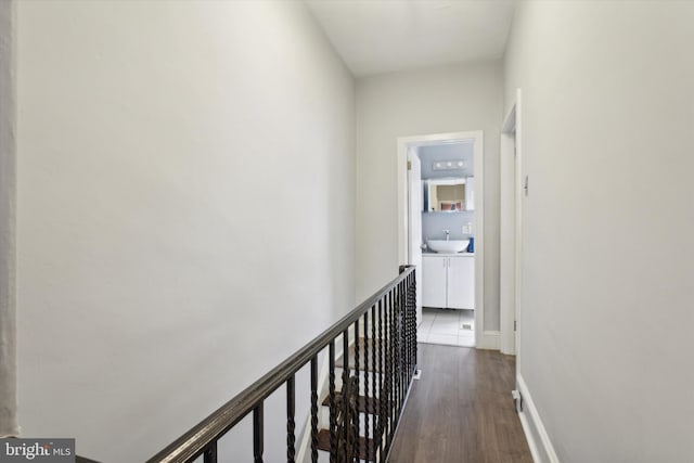 hallway with sink and dark hardwood / wood-style floors