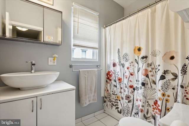 bathroom with a shower with shower curtain, tile patterned flooring, toilet, and vanity