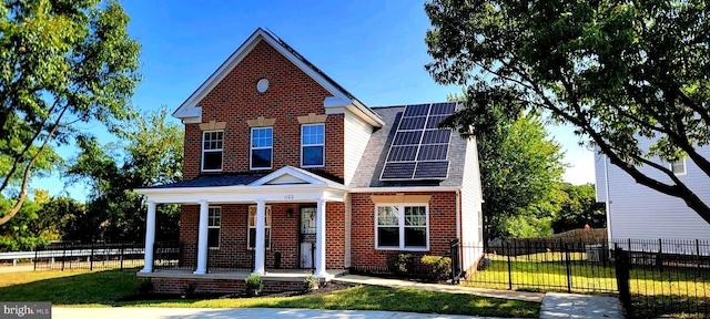 view of front of home featuring a front lawn and covered porch