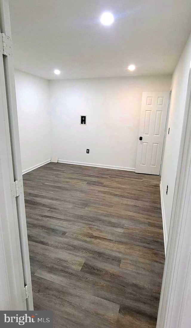 empty room featuring dark hardwood / wood-style flooring