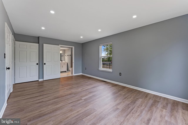 unfurnished bedroom with light hardwood / wood-style flooring