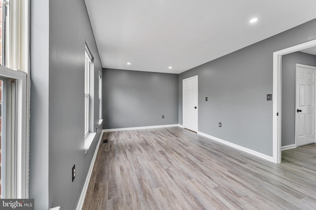 spare room featuring light wood-type flooring