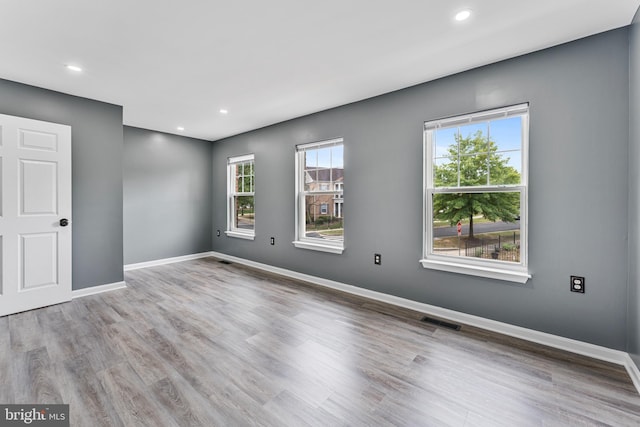 empty room featuring wood-type flooring