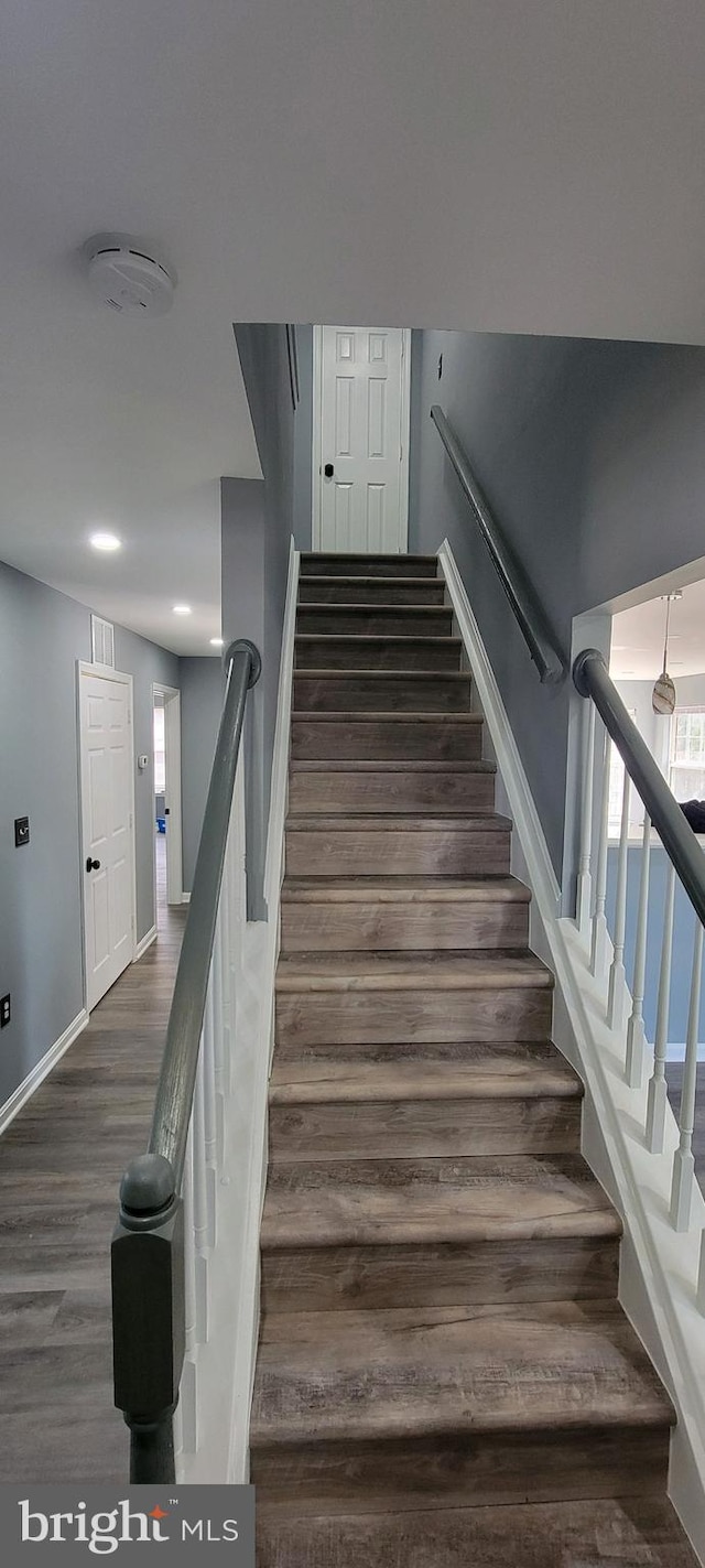 staircase featuring hardwood / wood-style floors