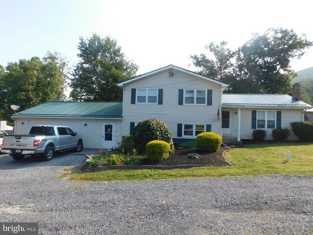 split level home featuring a front yard