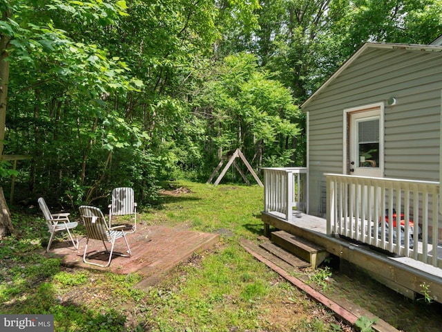 view of yard featuring a wooden deck