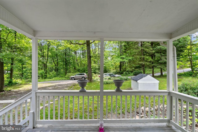 wooden deck with a lawn