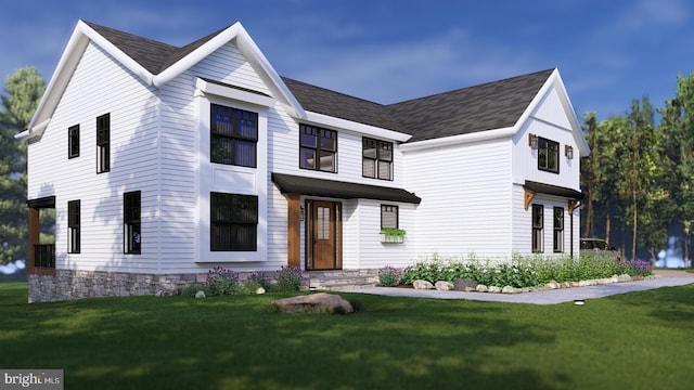 modern inspired farmhouse with a front lawn