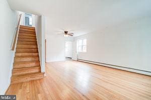 interior space featuring hardwood / wood-style flooring and ceiling fan