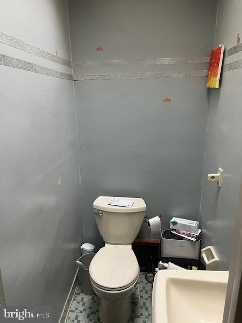 bathroom with tile patterned floors and toilet