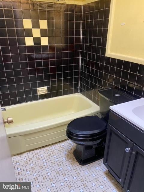 full bathroom with bathing tub / shower combination, vanity, and toilet