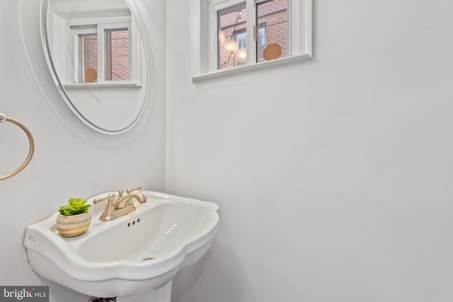 bathroom featuring plenty of natural light and sink