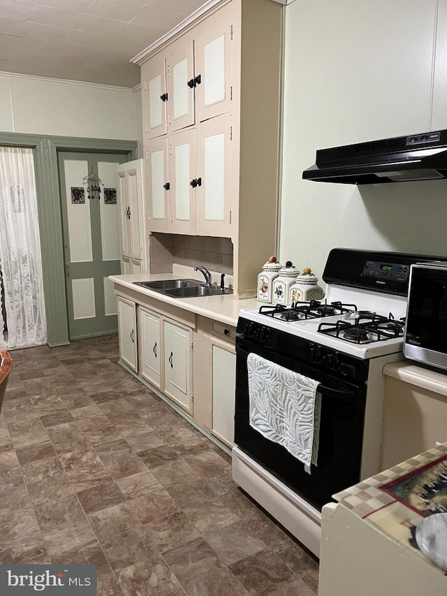 kitchen featuring ventilation hood, white cabinets, crown molding, sink, and white gas range oven