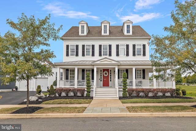 view of front facade featuring a garage and a porch