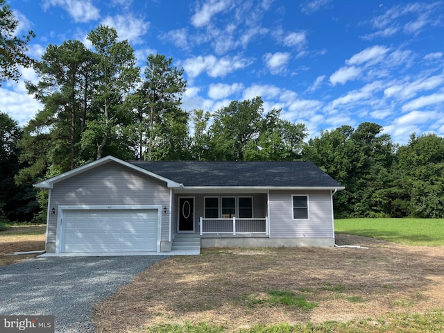 single story home featuring a porch and a garage