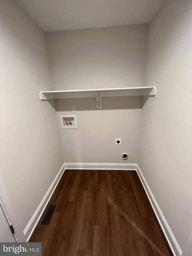 laundry room with hardwood / wood-style flooring, hookup for an electric dryer, and washer hookup