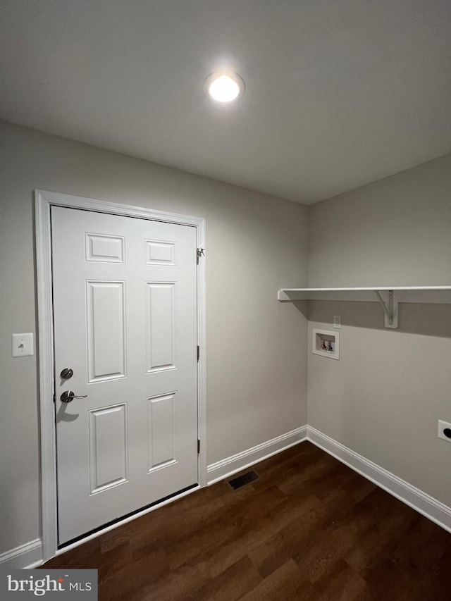 laundry room featuring dark wood-type flooring and hookup for a washing machine