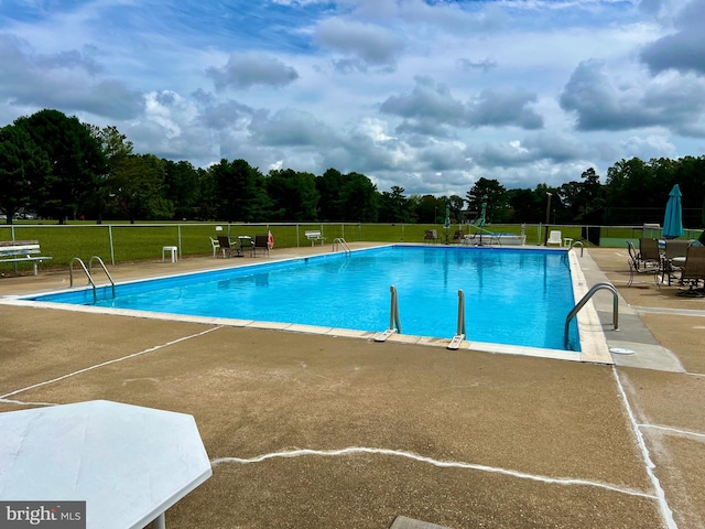 view of pool featuring a patio