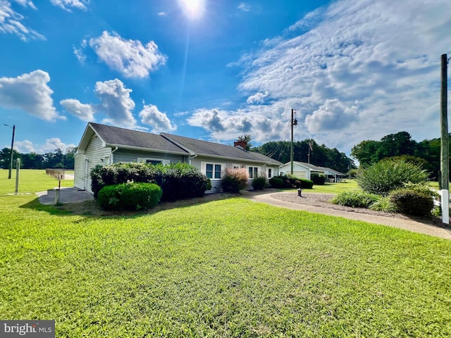 view of property exterior featuring a lawn