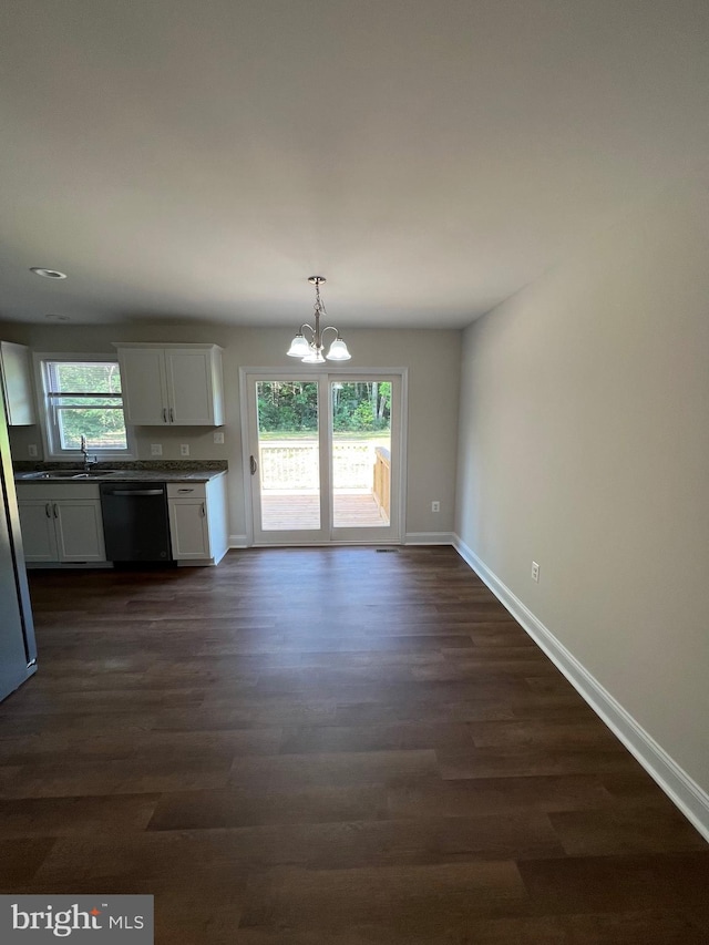 kitchen featuring a healthy amount of sunlight, dark hardwood / wood-style flooring, white cabinetry, and black dishwasher