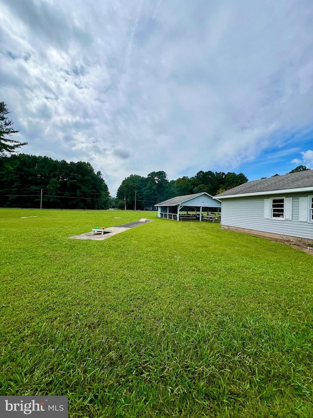 view of yard with a fire pit