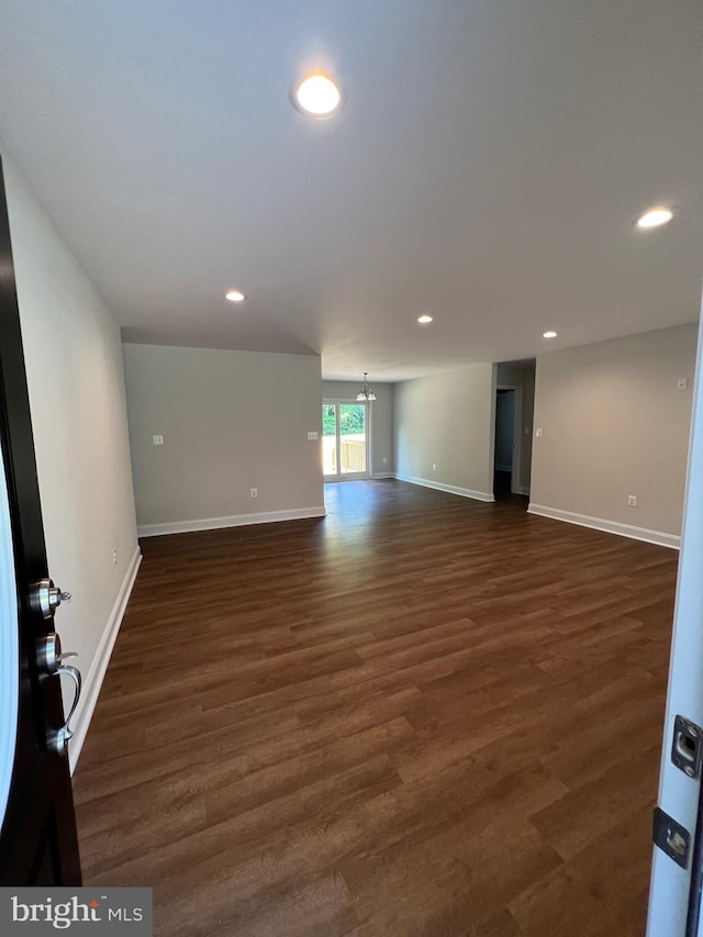 empty room featuring dark hardwood / wood-style floors