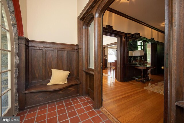 interior space with hardwood / wood-style flooring and ornamental molding