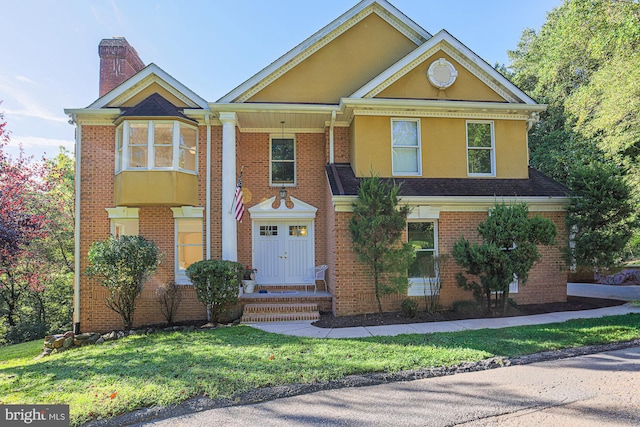 view of front facade featuring a front yard