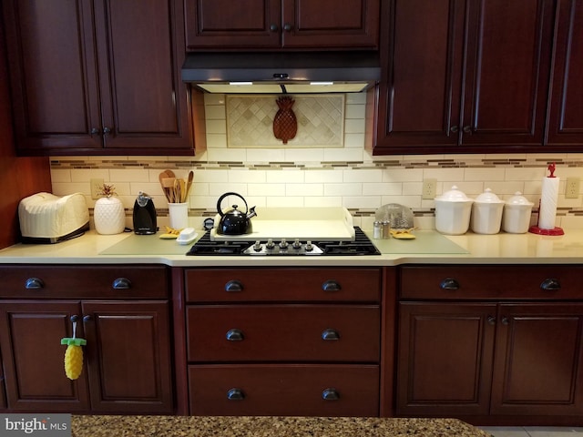 kitchen with decorative backsplash, black gas cooktop, and exhaust hood