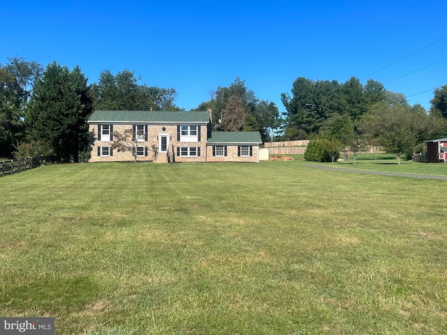 view of front of home with a front lawn