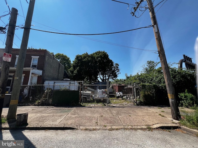 view of yard with fence and a gate