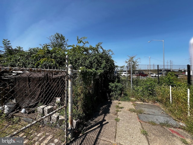 view of gate featuring fence