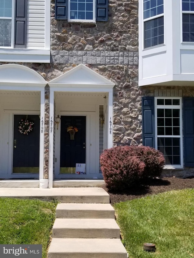 entrance to property with stone siding