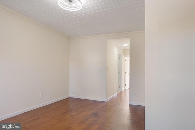 unfurnished room featuring wood-type flooring and ornamental molding